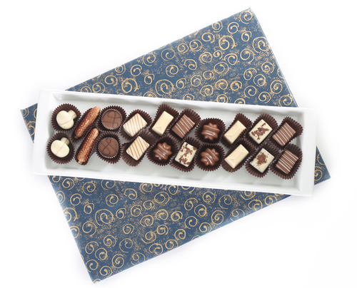 Long white Ceramic tray filled with Chocolates
