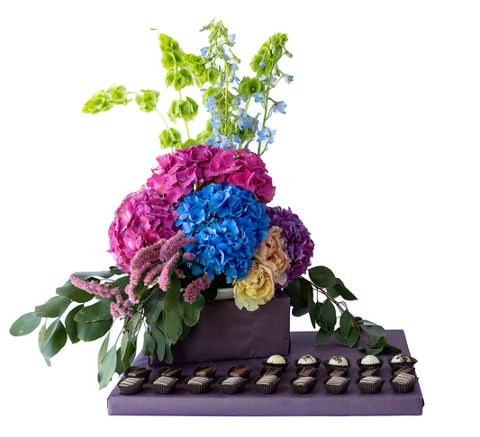 Large fresh flower arrangement with dairy Belgian Pralines
