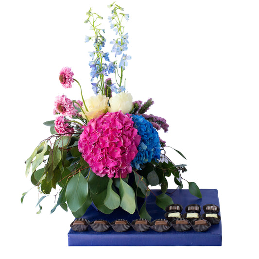 Small fresh flower arrangement with dairy Belgian Pralines