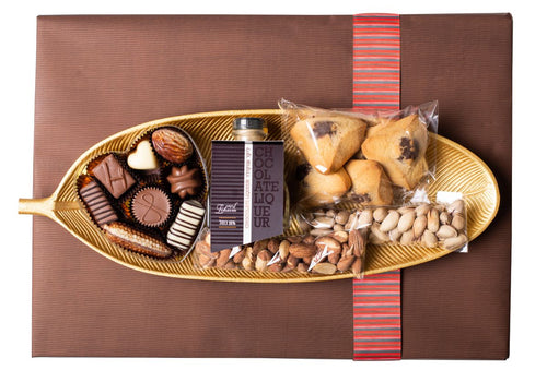 Gold leaf-shaped plate filled with scrumptious goodies