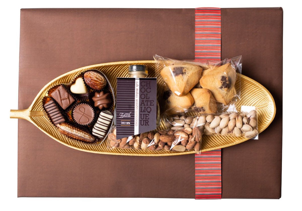 Gold leaf-shaped plate filled with scrumptious goodies