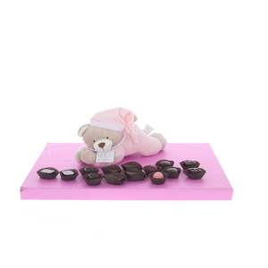 Pink lying teddy with display of Belgian chocolates