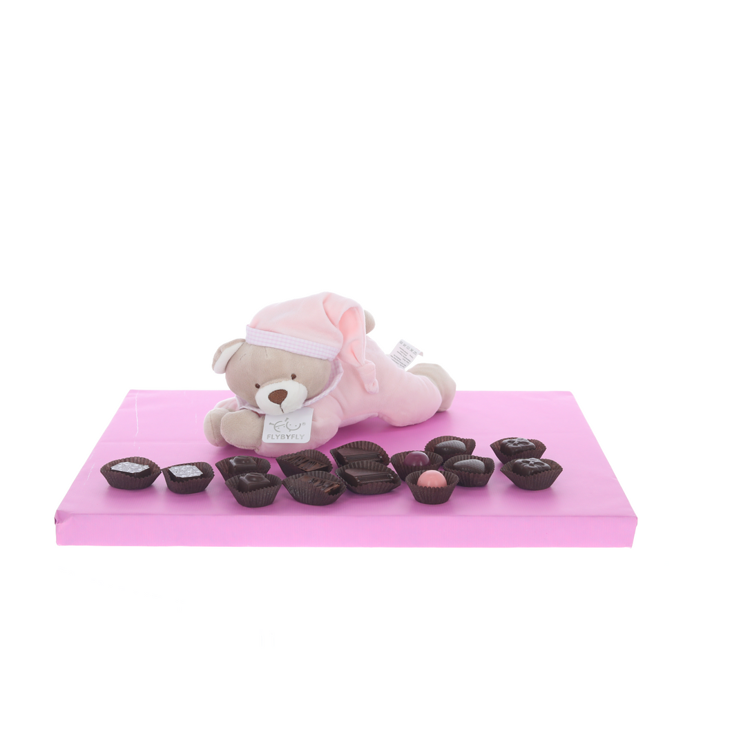 Pink lying teddy with display of Belgian chocolates