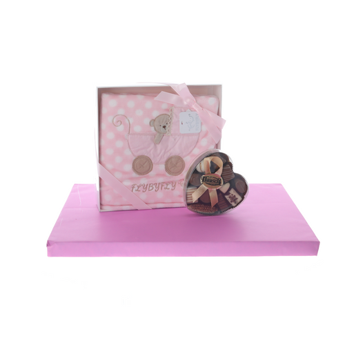 Pink blanket with heart-shaped box of dairy pralines