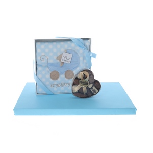 Blue blanket with heart-shaped box of dairy pralines